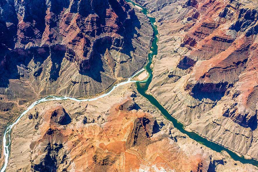 The Little Colorado River meets the Colorado River known as The Confluence at the Grand Canyon. (Photo courtesy of EcoFlight.)