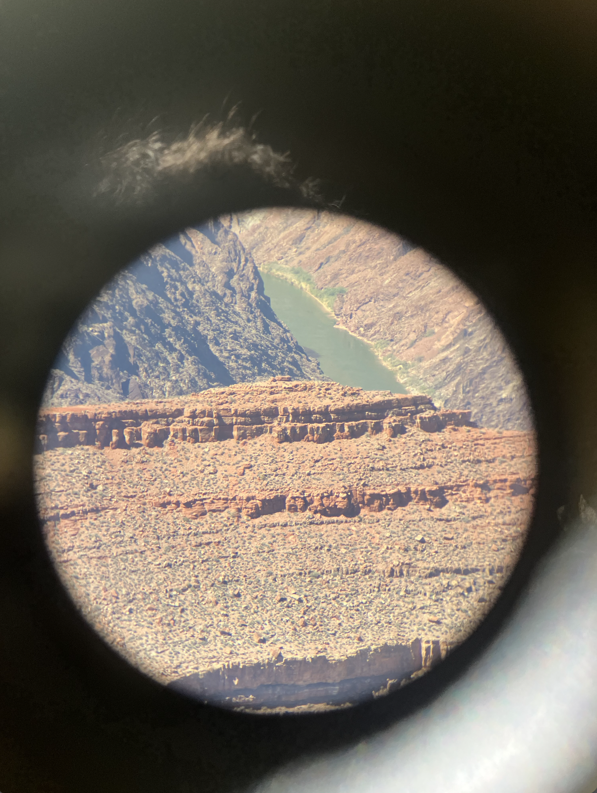 image of canyon appears through telescope portal